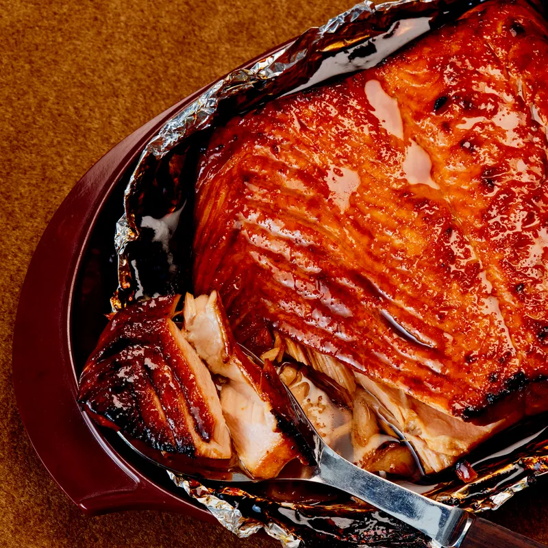 A macro view of a spooned-in, roasted salmon. 