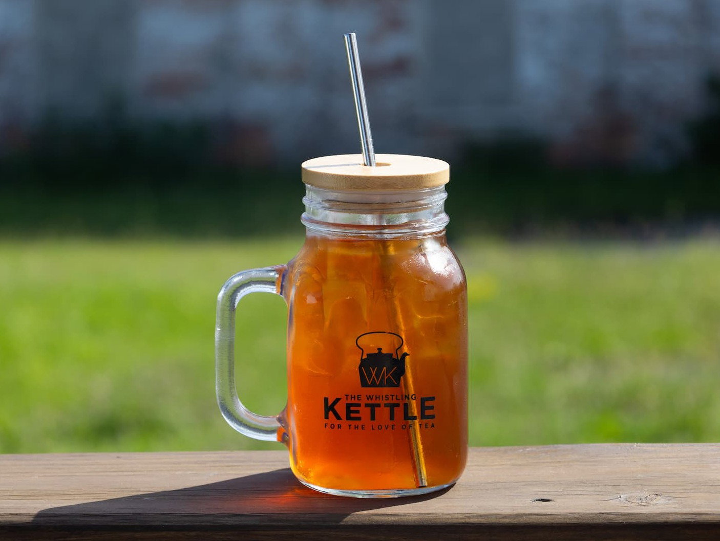 Frosty Mason Jar with black iced tea on a porch