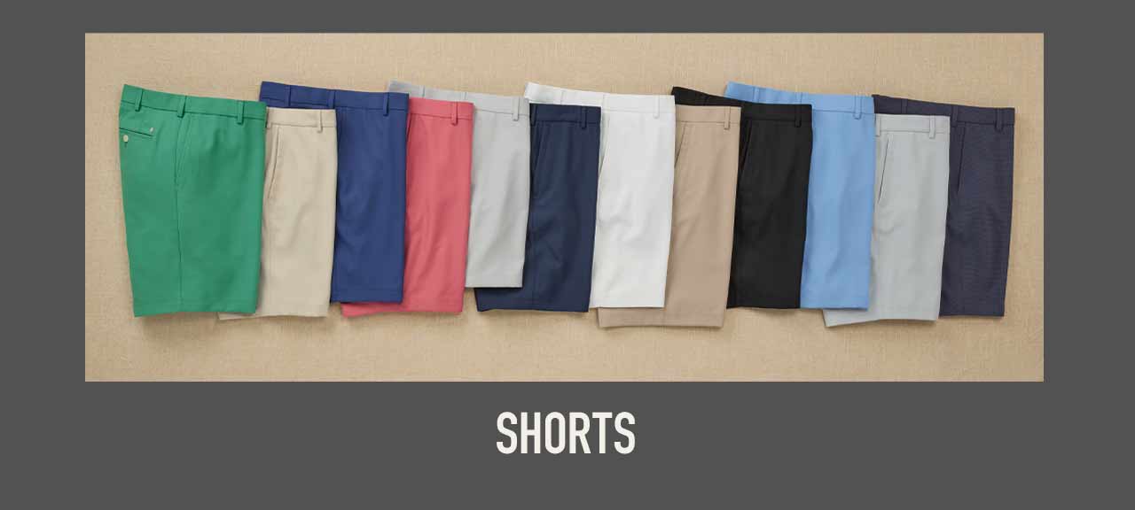 Fan of ten Westport Lifestyle shorts laid flat in green, tan, blue, coral, gray, navy, white, khaki, black, and light blue, with Shorts label