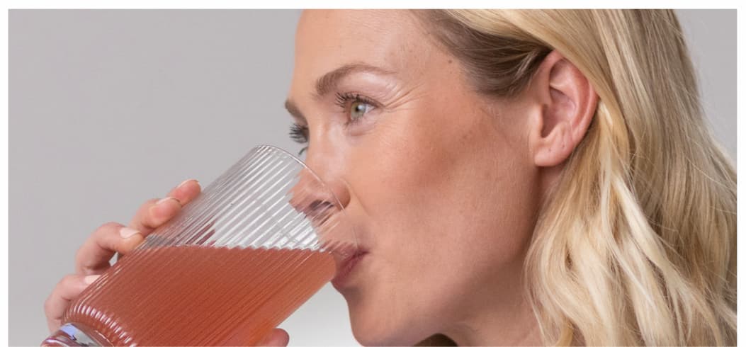 Woman drinking Slim Sips. 