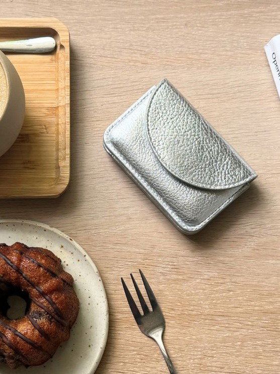 Wallet on table with dessert
