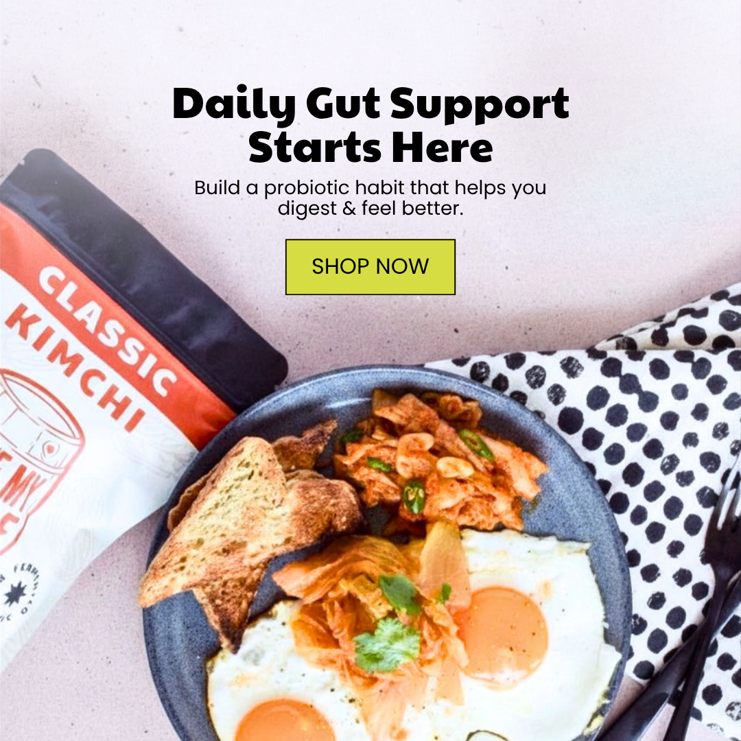 A plate with two fried eggs, toasted bread, and kimchi, next to a Classic Kimchi product package. Overlay text promotes gut support.