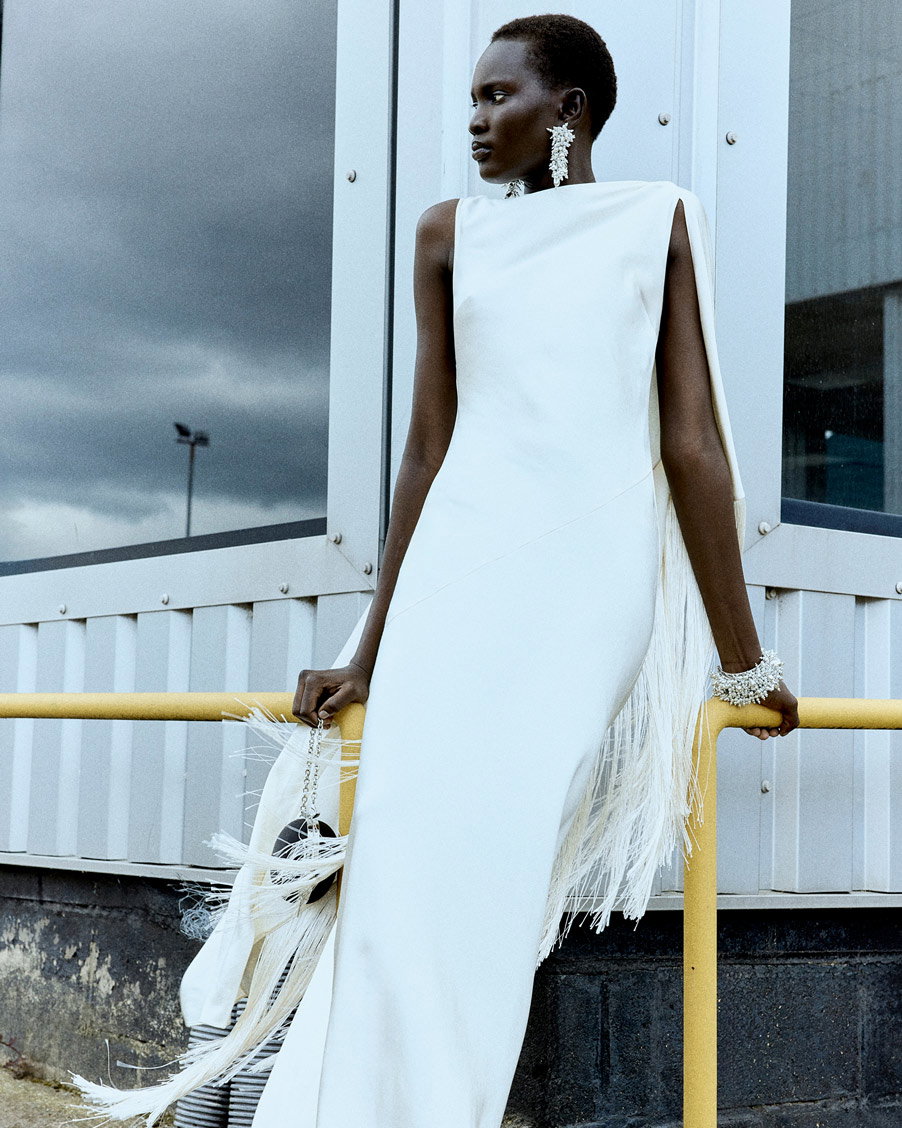 A picture of a woman wearing the Silver Rhinestone Draped Mini Dress