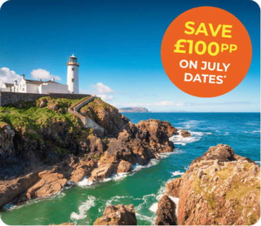 Coastal view featuring a lighthouse, rocky shoreline, and vibrant blue sea under a clear sky.