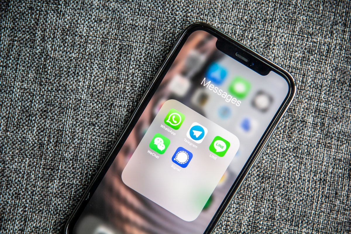 A mobile phone showing messaging apps