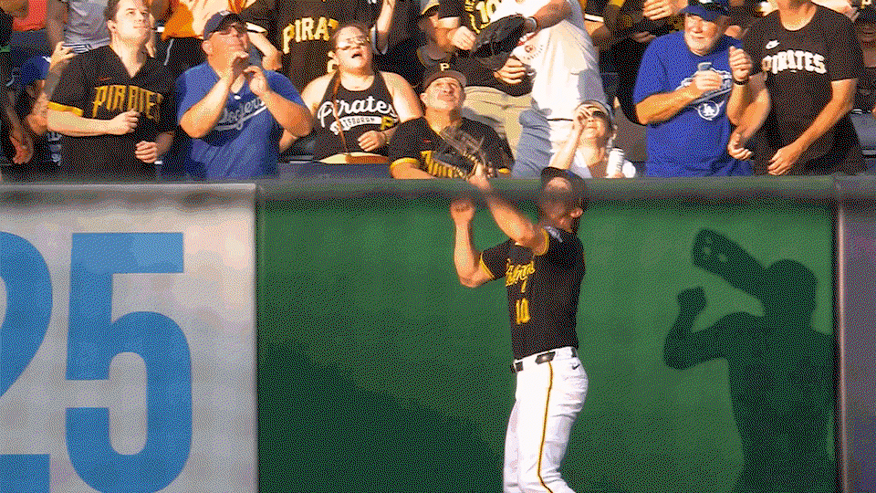 An animated gif of Bryan Reynolds leaping to rob a home run before slamming into the wall