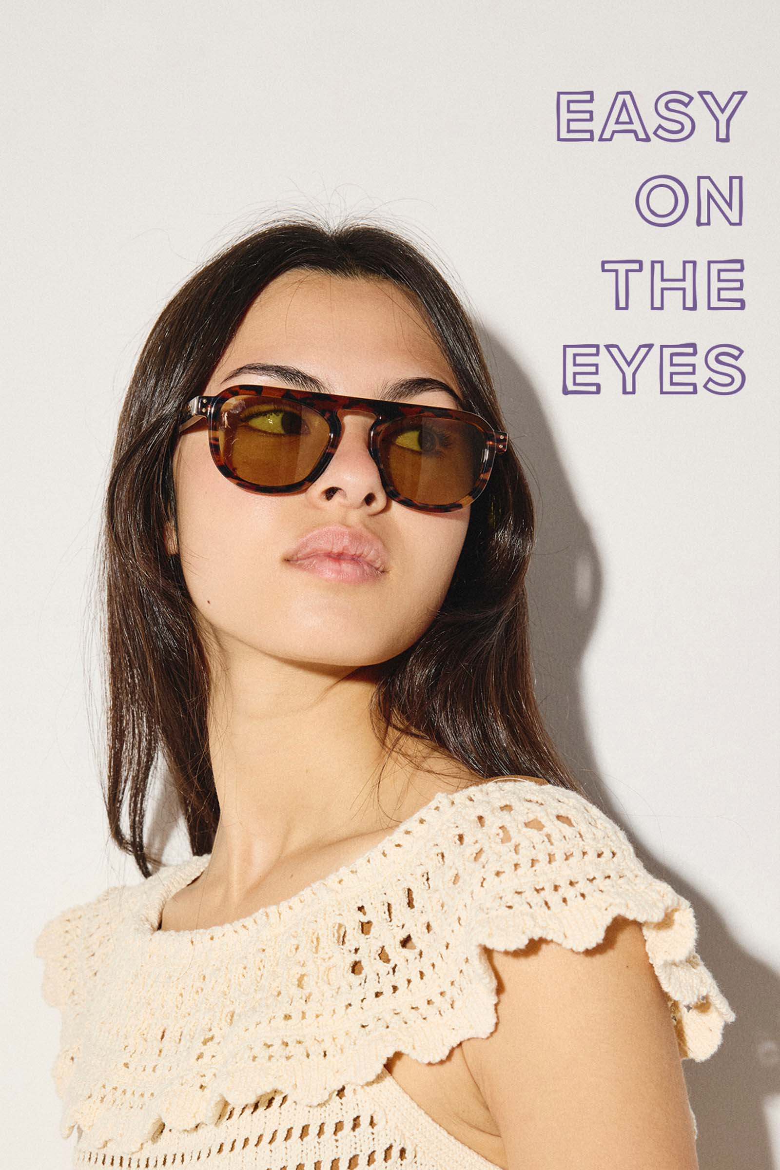 Women in sunglasses and crochet dress