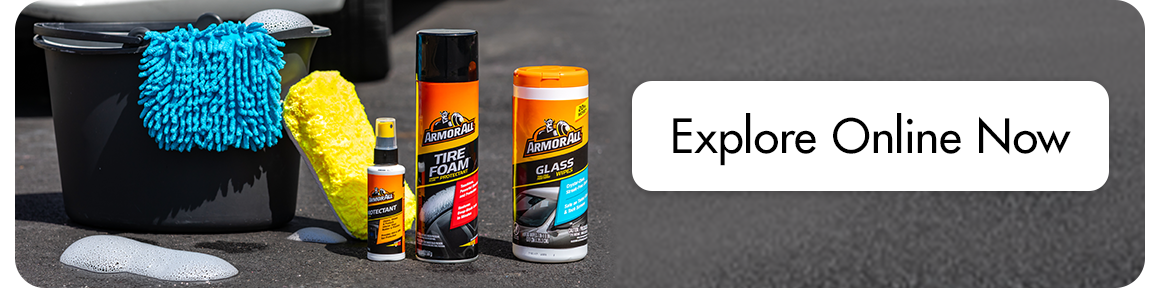 Explore Online Now  next to tire and glass cleaner bottles, a bucket, sponge, and a microfiber buffing cloth