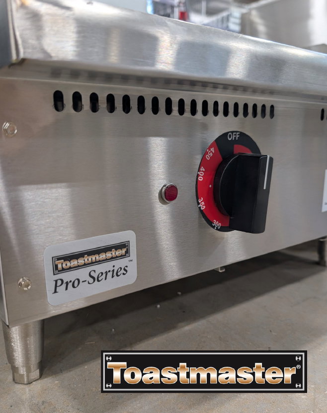 Toastmaster Pro‑Series countertop commercial griddle featuring a stainless steel body with adjustable temperature control dial in a kitchen setting.
