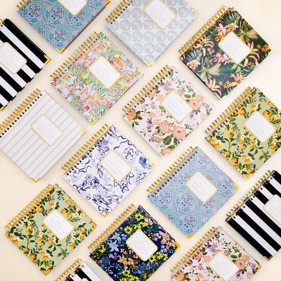 rotating images of assorted day designer planners in pretty patterns