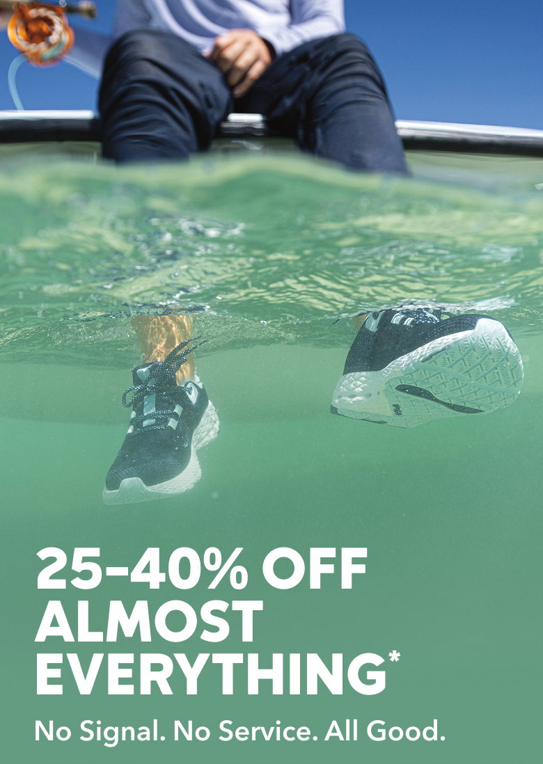 Person with their feet dangling in water. 25-40% off almost everything. No signal. No service. All good.