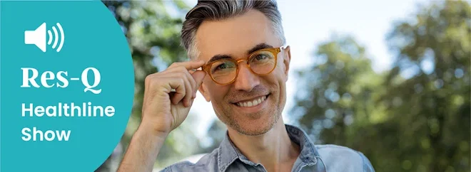 A man walks outside with nice glasses