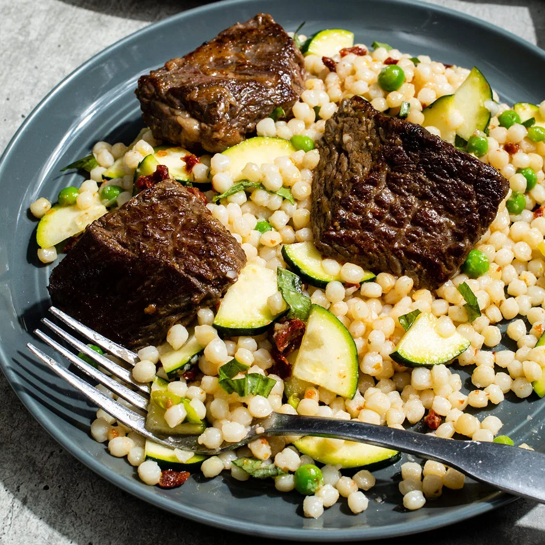 Lemony Steak Tips with Zucchini and Sun-Dried Tomato Couscous