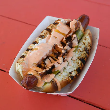 The Nashville SC Dog is an off menu dog served with cream cheese, bacon, jalape–os, peaches with Big Daddy's secret sauce, only served at Geodis Stadium in Nashville, Tenn., Friday, April 22, 2022. 