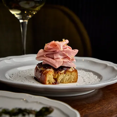 Mortadella focaccia toast with apricot mostarda is among the starters at Alla Vita.