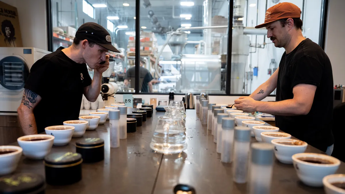 Max Oden, and Ty Telgenhof evaluate and taste the different coffee roasts to make sure they’re up to standard inside 8th and Roast Coffee’s training lab and roasting facility, in Nashville, Tenn., on Tuesday, May 19, 2026.