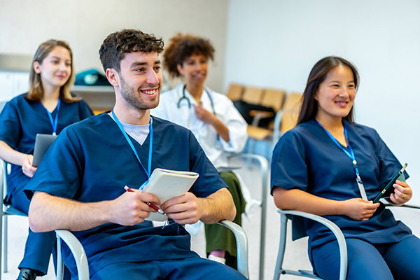A photograph of medical students in a classroom.
