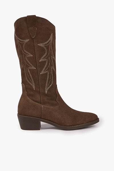 Brown suede cowboy boot with decorative stitching and low heel on white background.