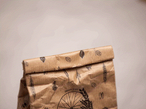 Bamboo bag clip clipped onto a coffee bag