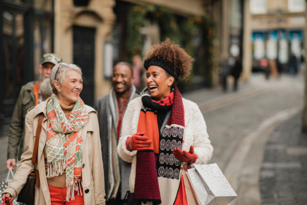 Couples and people chatting and laughing on the street