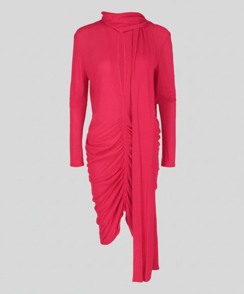 A bright pink, long-sleeved dress with a draped neckline and ruched detailing.