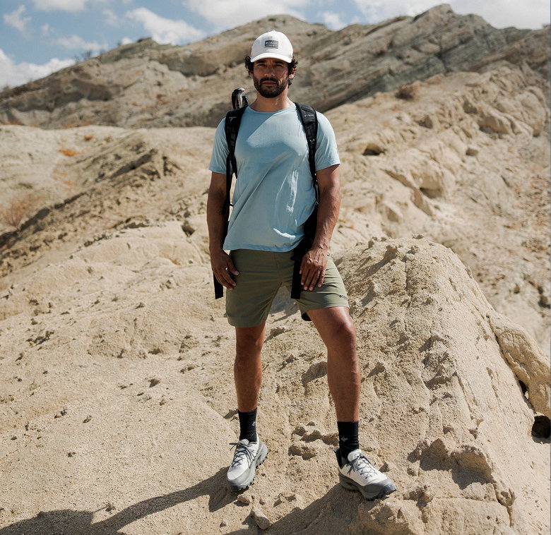 Man standing on rocky terrain. 