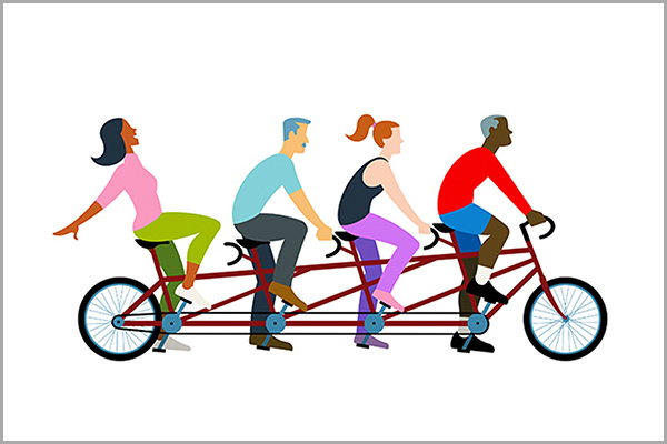 People riding a tandem bike.