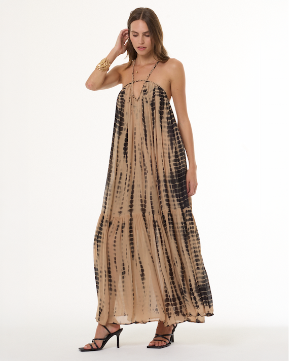 Woman wearing tan and brown flowy dress