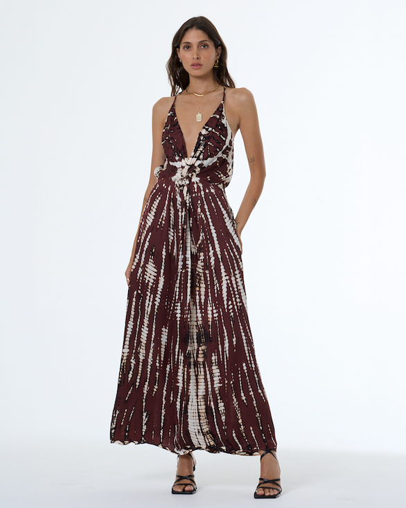 Woman wearing white and brown print dress