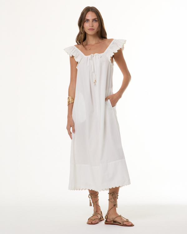 Woman wearing white eyelet dress