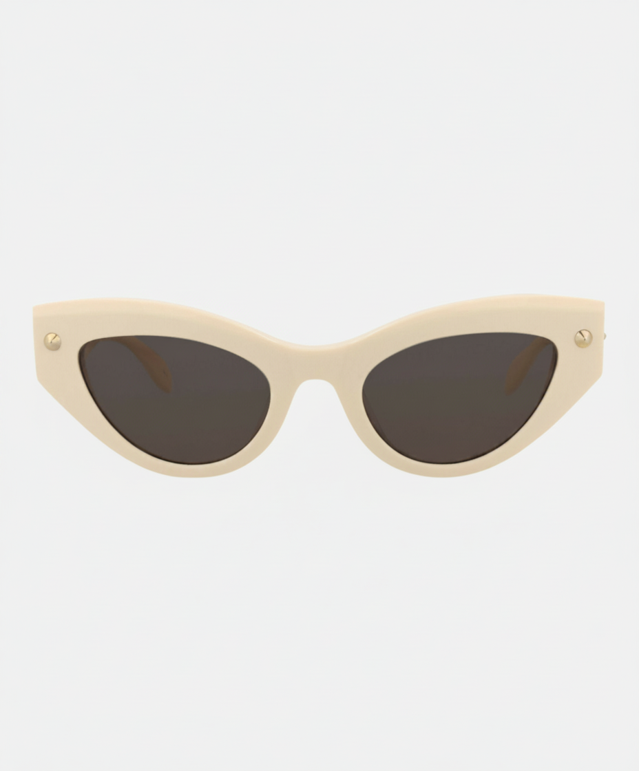 Cat-eye sunglasses with a cream frame and dark lenses.