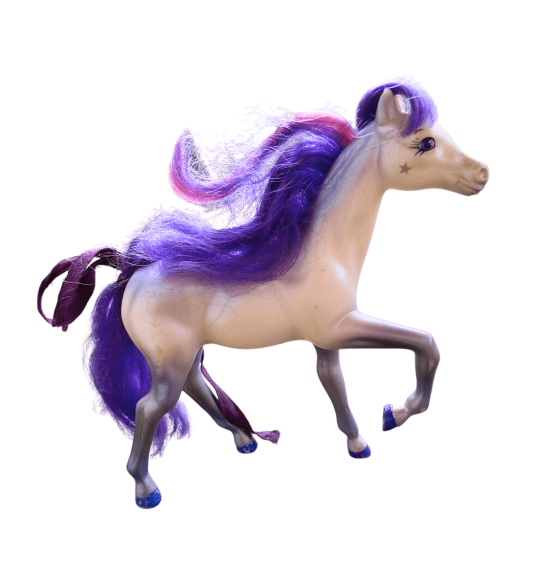 Toy pony with stars and purple hair. She's beautiful.