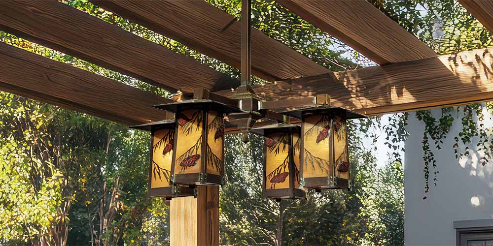 An outdoor chandelier with stained glass butterflies.