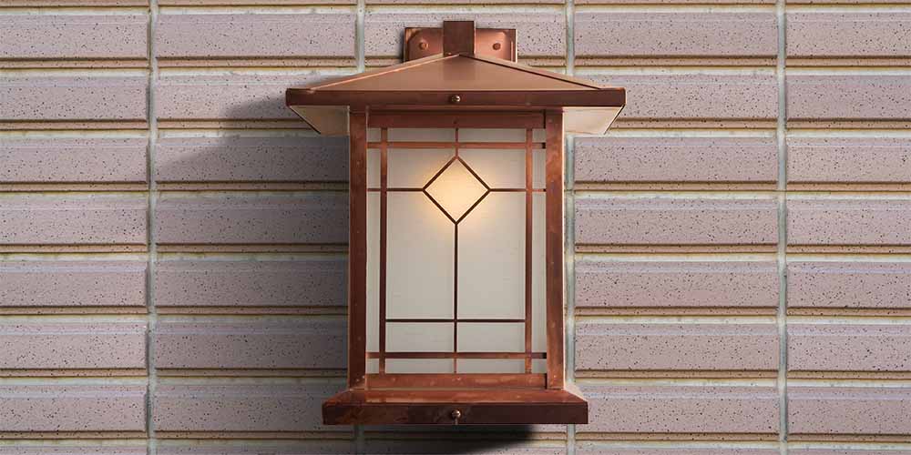 A Prairie School style wall light with lozenge pattern.