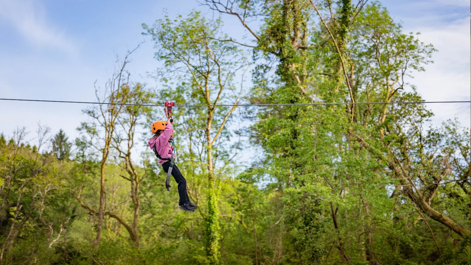 girl heading across the double glide zip