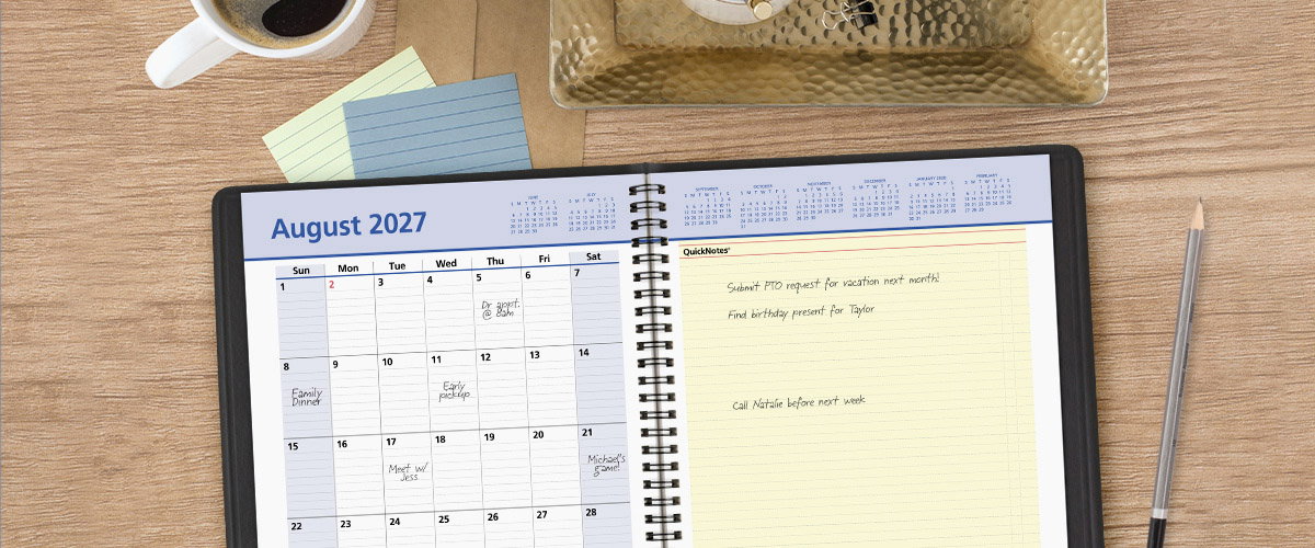 Overhead shot of an open AT-A-GLANCE monthly planner