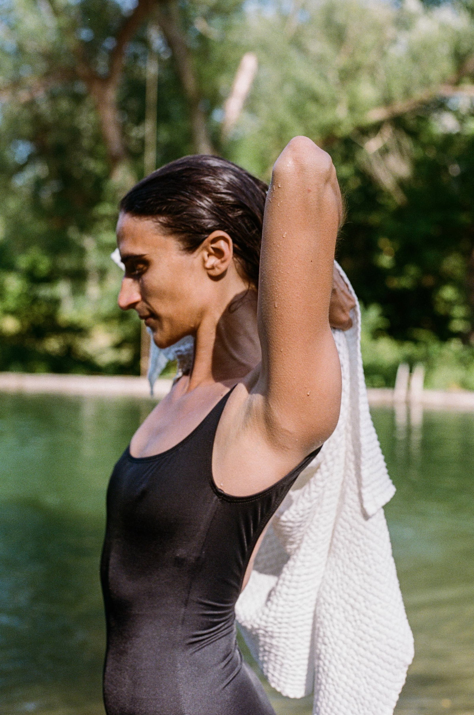 woman toweling off after an outdoor swim