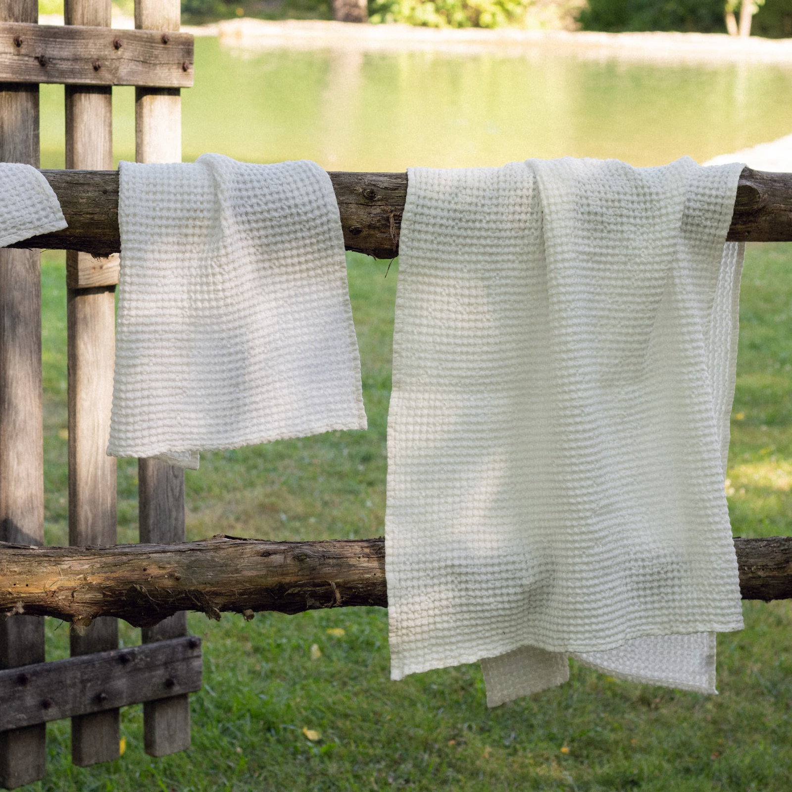 towels drying on a fence
