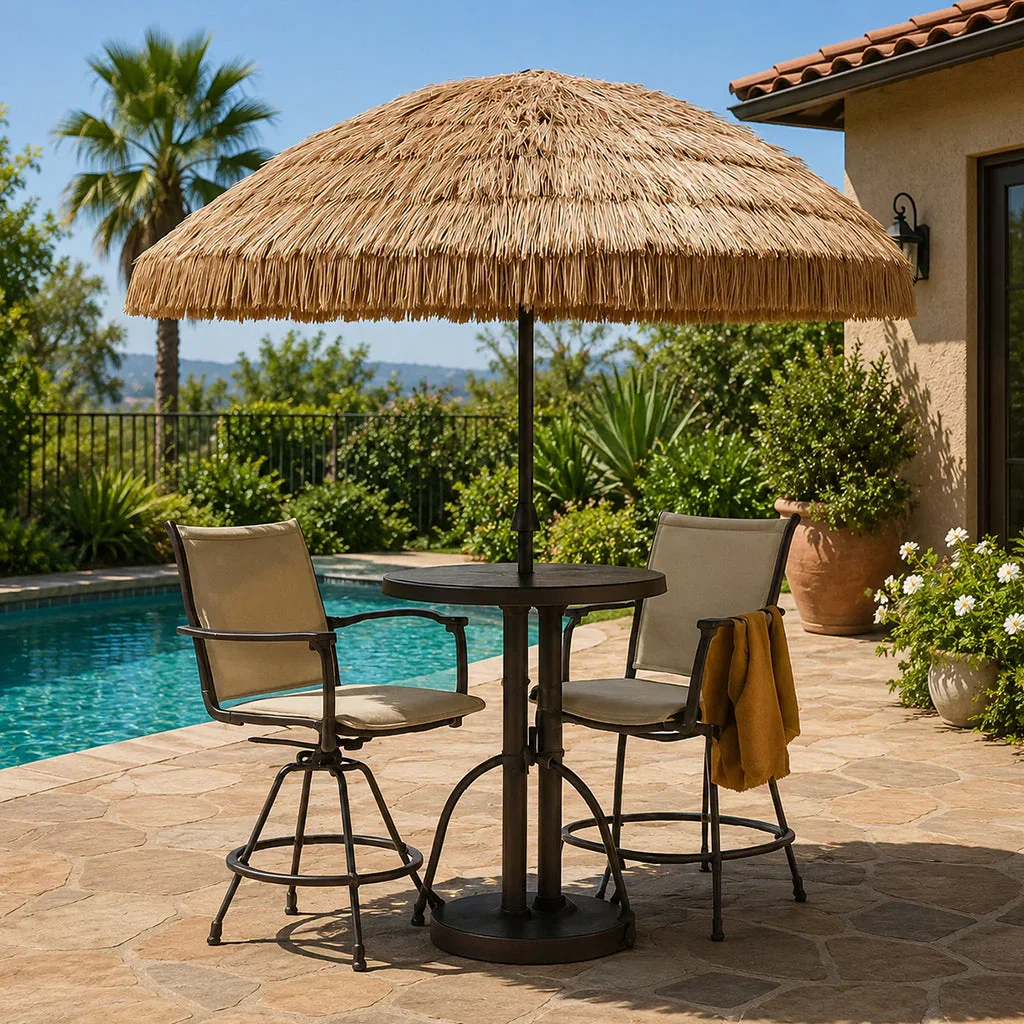 Outdoor patio set with bar-height chairs, round table, and thatched umbrella overlooking a swimming pool and mountains.