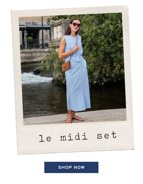 Le Midi Set - Shop now - Image of a woman wearing a light blue seersucker top and a matching maxi skirt