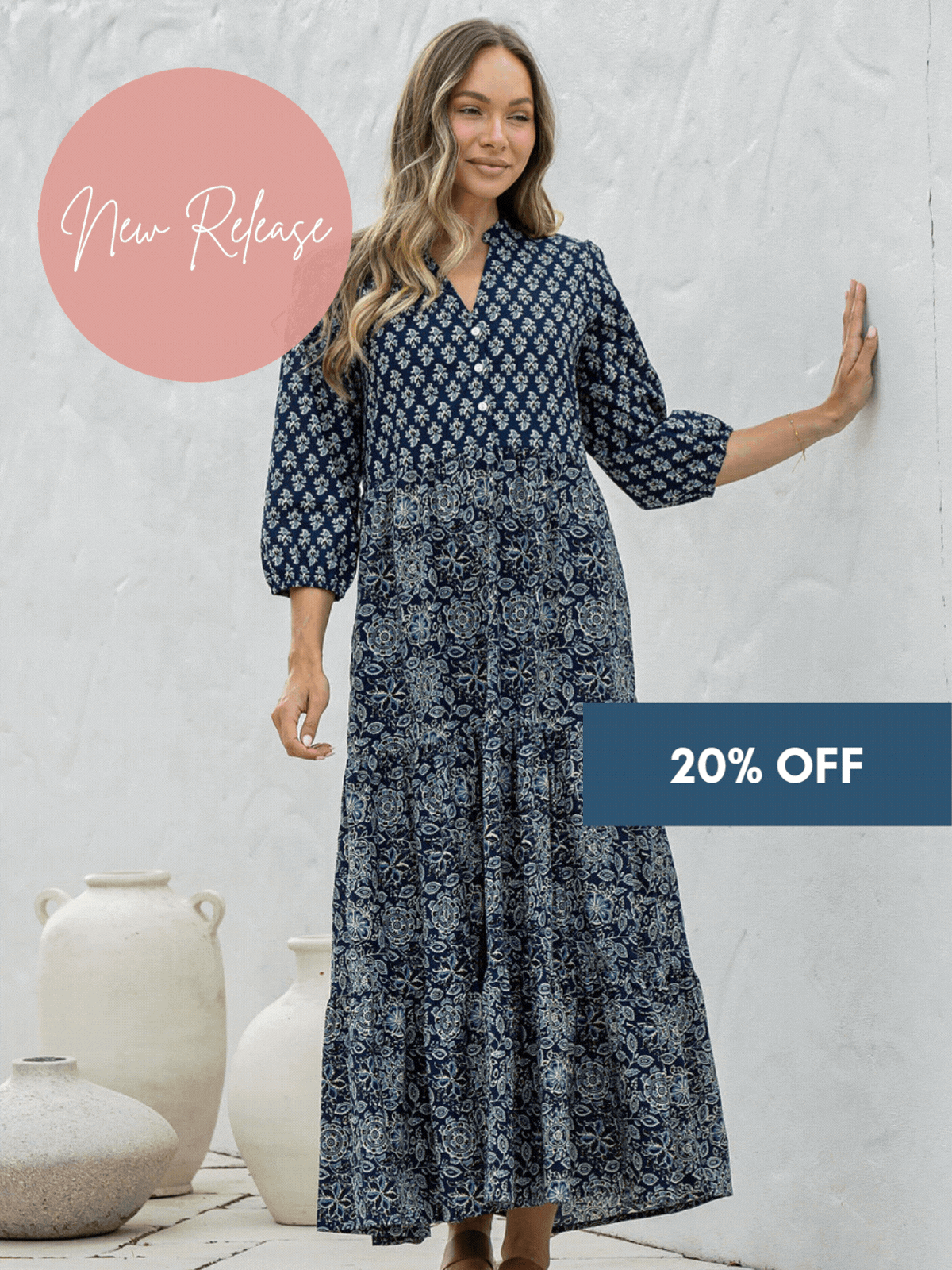woman in blue and white maxi dress on country pathway