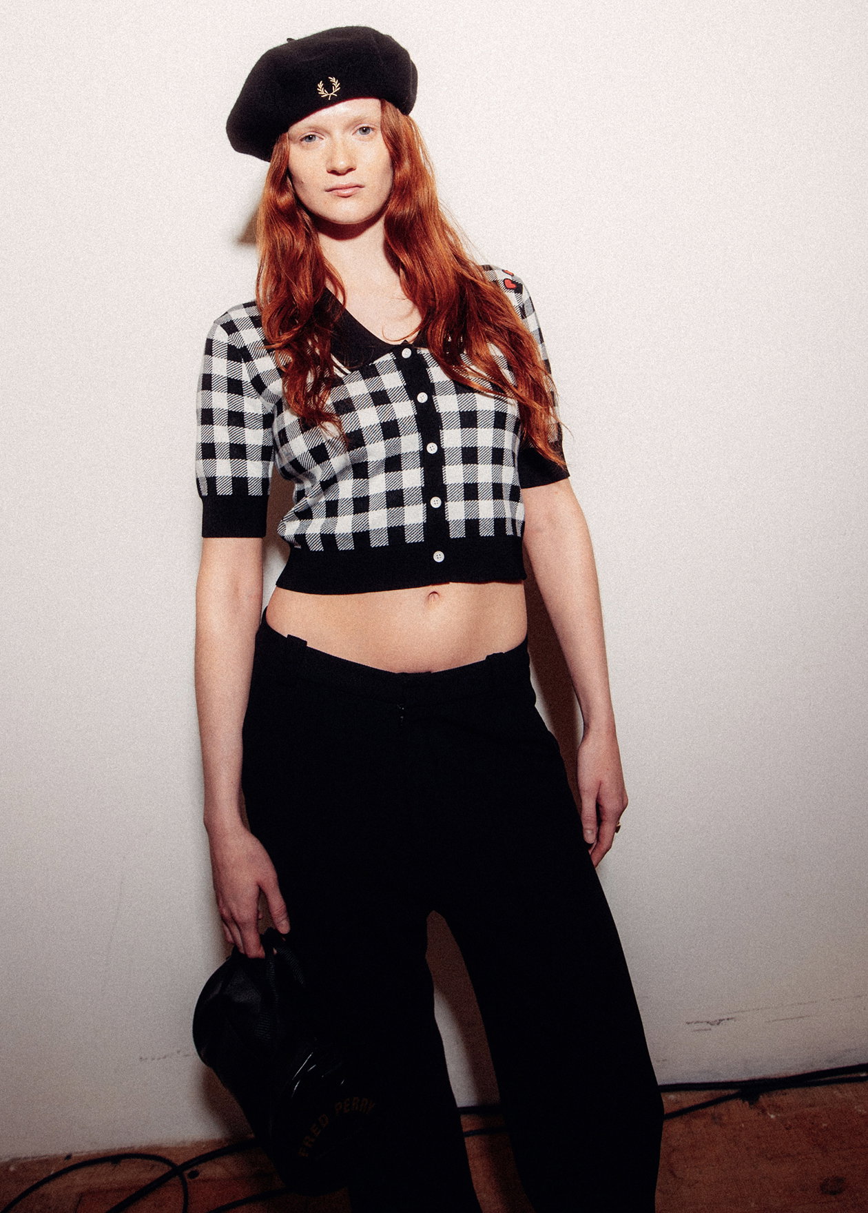 Female model wearing a Fred Perry x Amy Winehouse Foundation Gingham Knitted Shirt