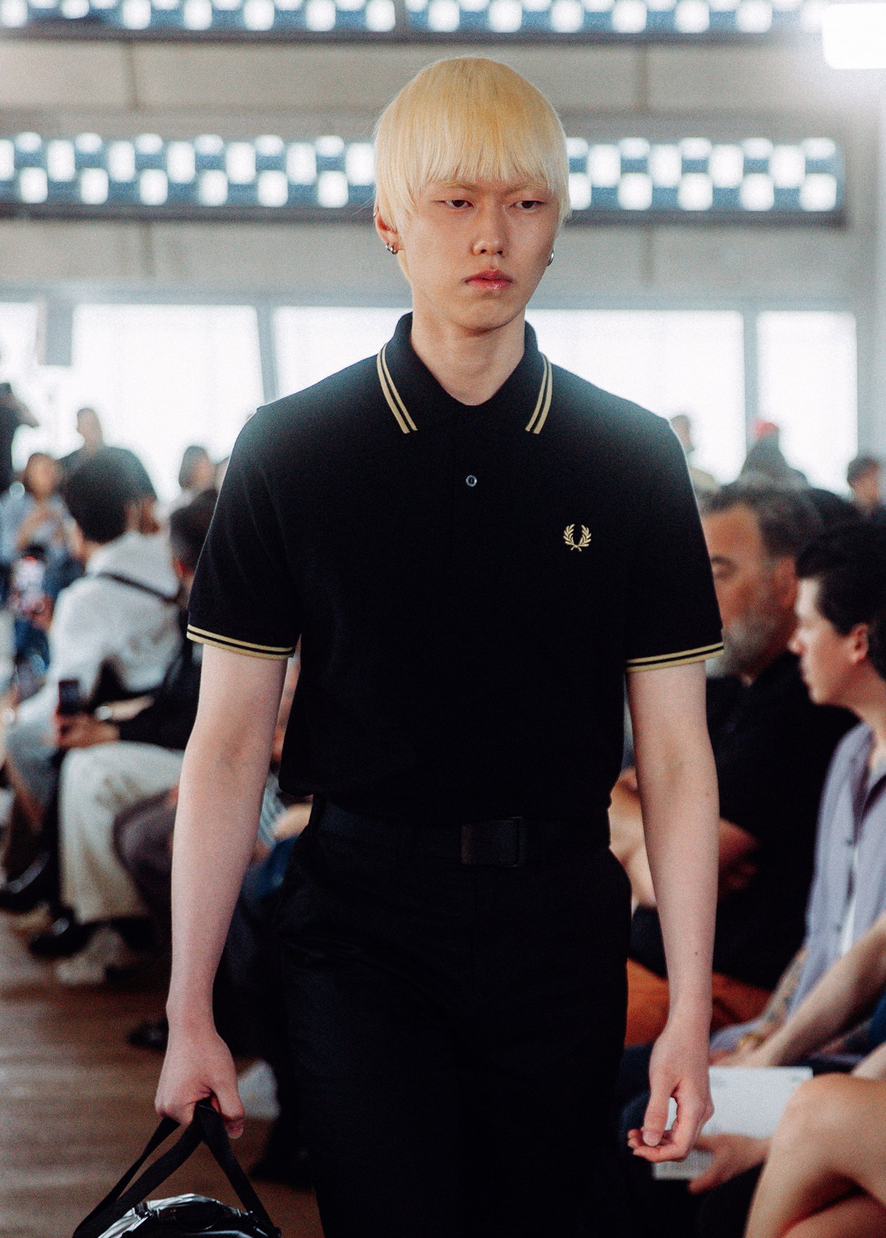 Male model wearing a Black / Champagne Fred Perry Shirt