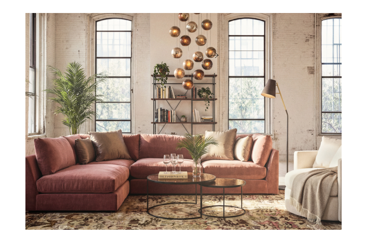 Industrial loft with sectional, nesting coffee tables, pendant lights, and swivel chair