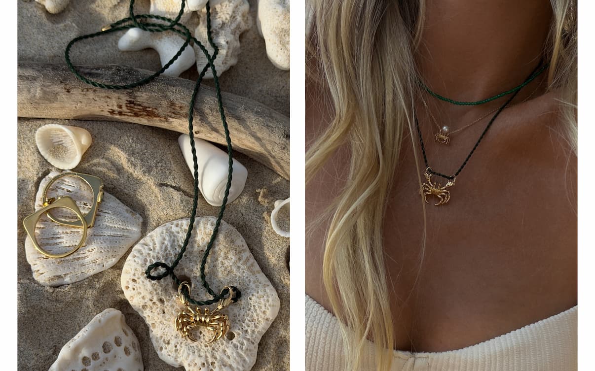 Left panel: Mejuri gold crab pendant necklace and geometric ring laid out among seashells on sand. Right panel: Woman's neckline layered with a Mejuri gold crab pendant necklace and green beaded necklace.