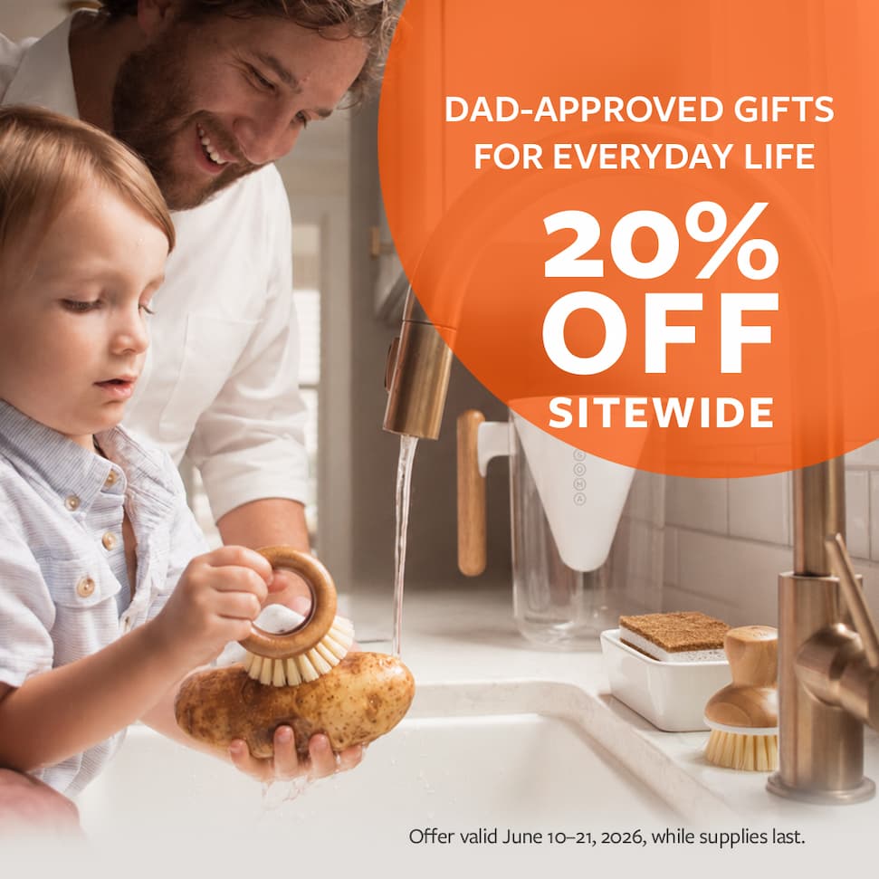 Son and father cleaning veggies. Text reads Dad-approved gifts for everyday life. 20% off sitewide.