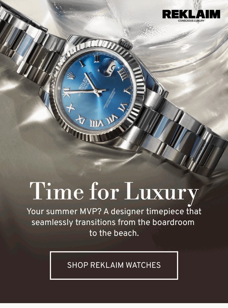 Stainless steel watch with blue dial on reflective surface. Time for Luxury. Your summer MVP. Click to Shop REKLAIM Watches