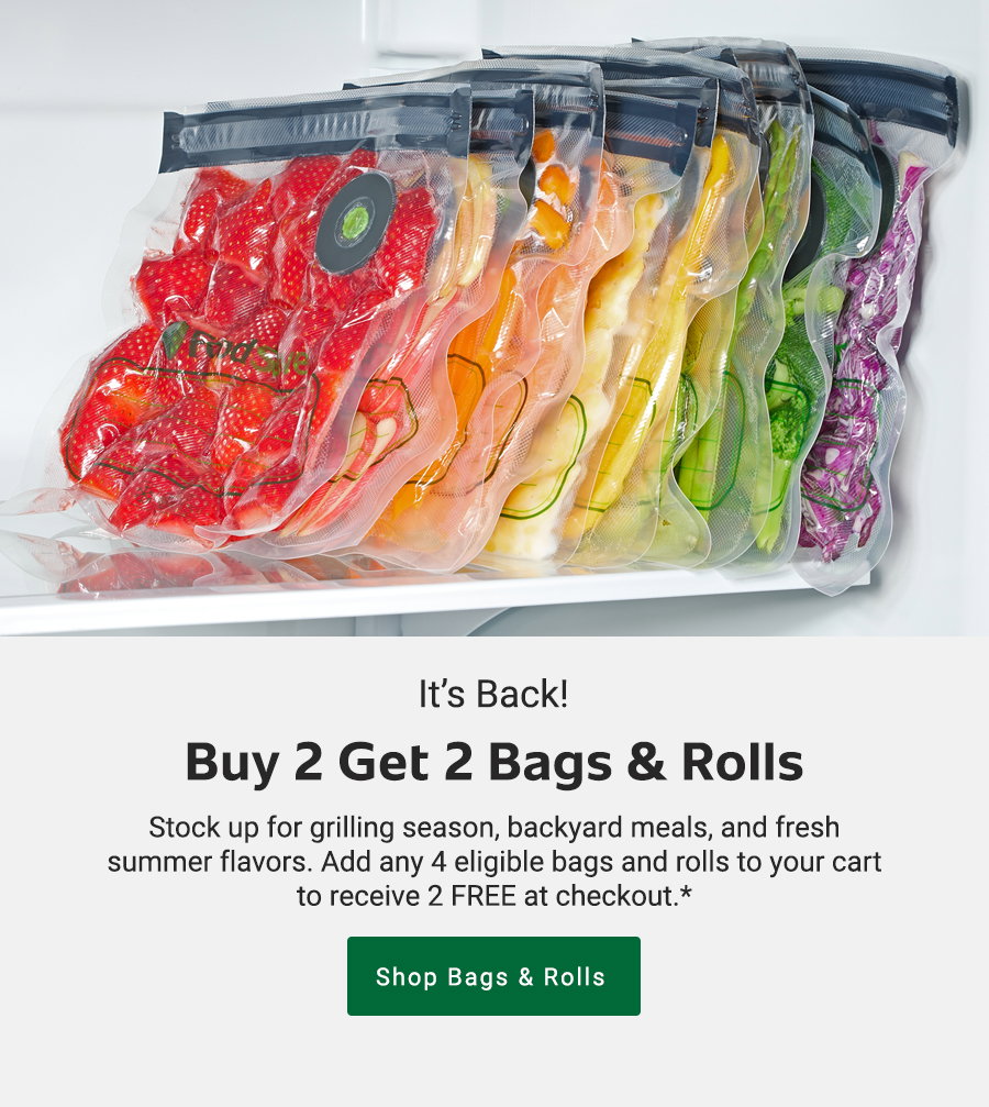 Assorted sliced fruits and vegetables in vacuum-sealed bags in a fridge, text reads buy 2 get 2 bags and rolls. Green button says shop bags and rolls.