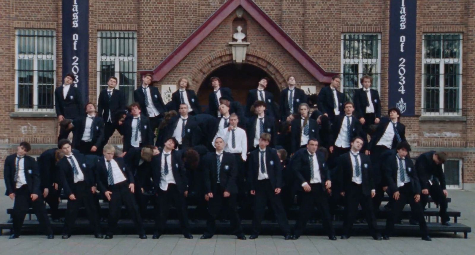 Still from art video, showing mock school photo line-up