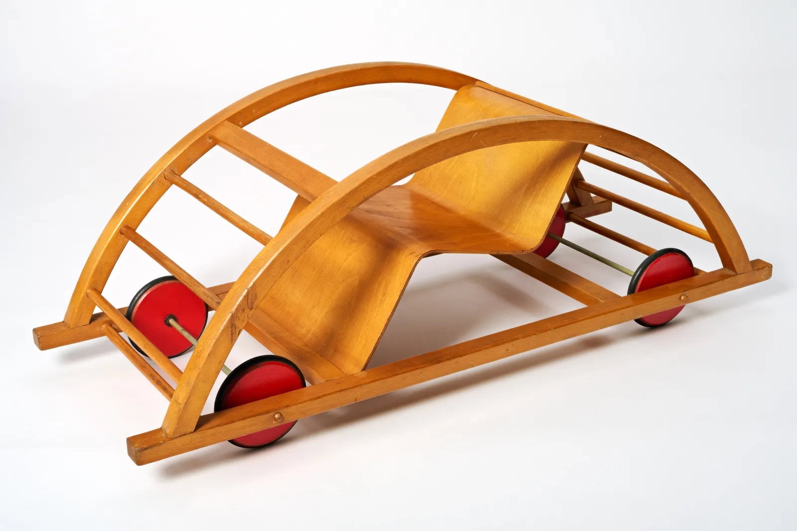 1950s wooden kid's chair on wheels, like a car